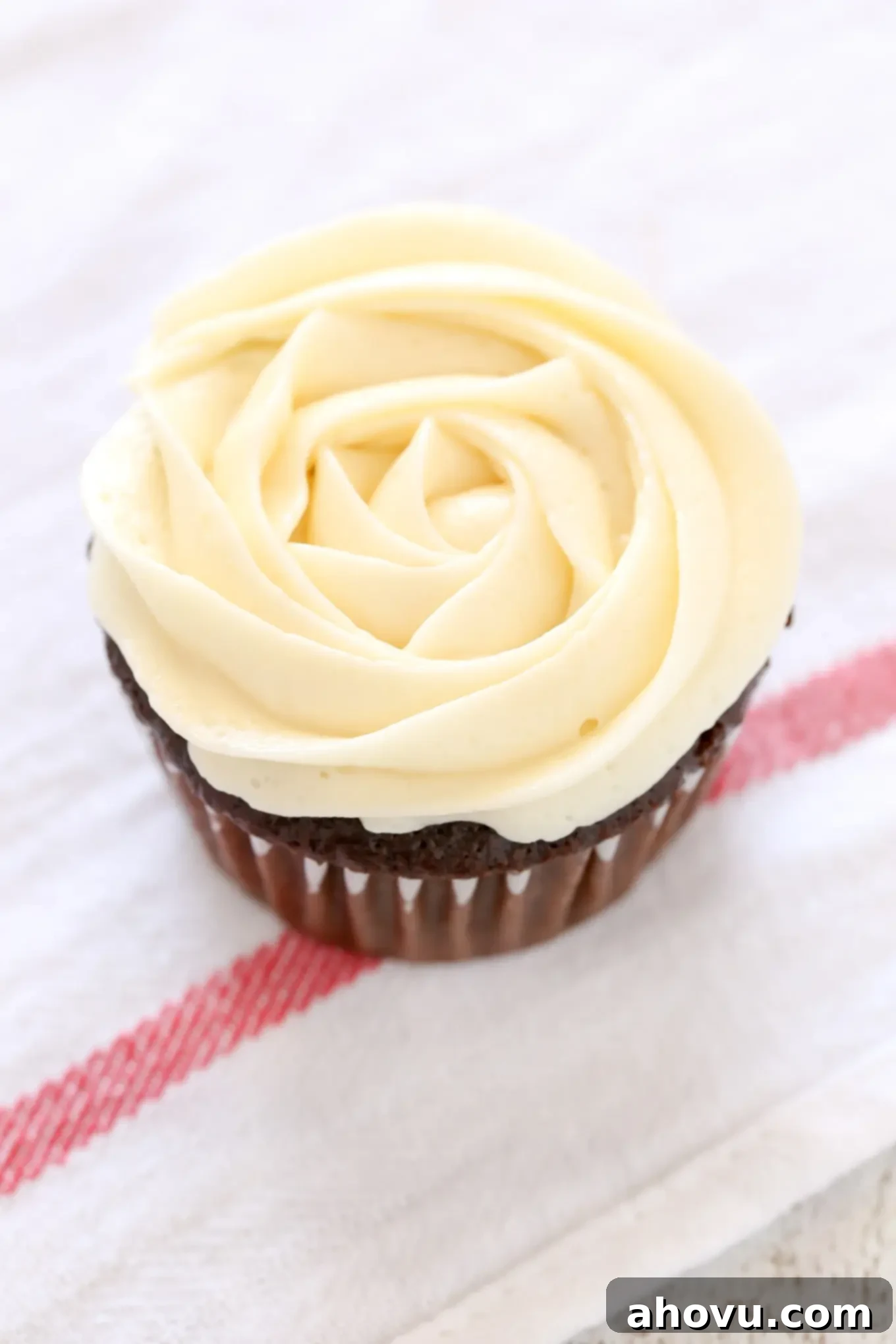 Completed buttercream rose frosting on a cupcake, ready for serving