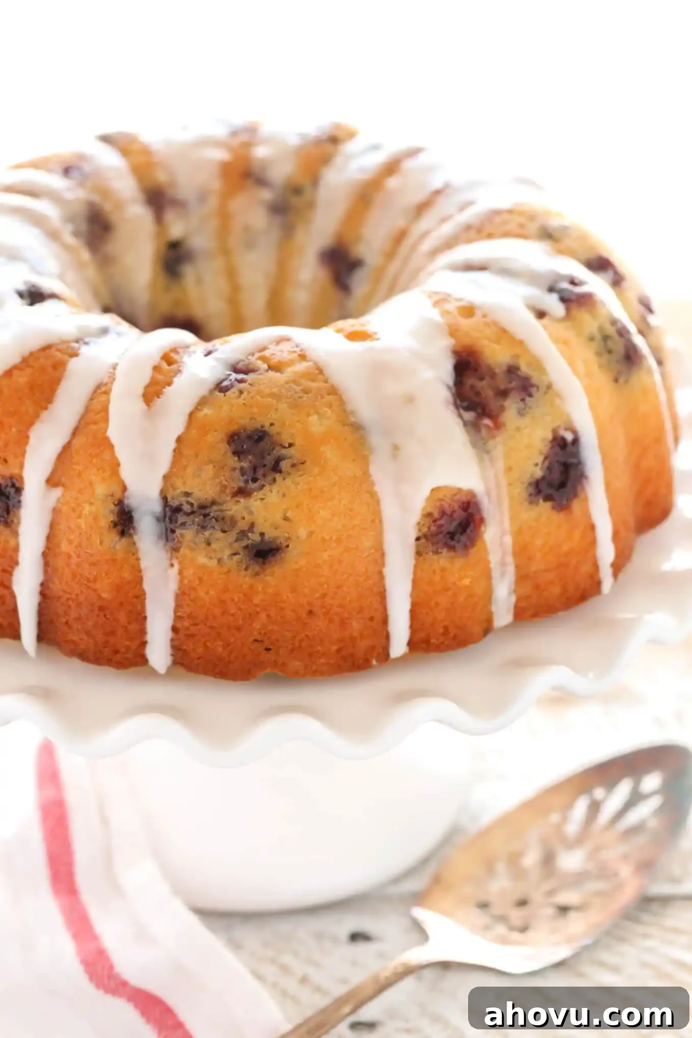 A moist lemon bundt cake filled with fresh blueberries and topped with a sweet lemon glaze. This Lemon Blueberry Bundt Cake is a perfect dessert for lemon lovers!