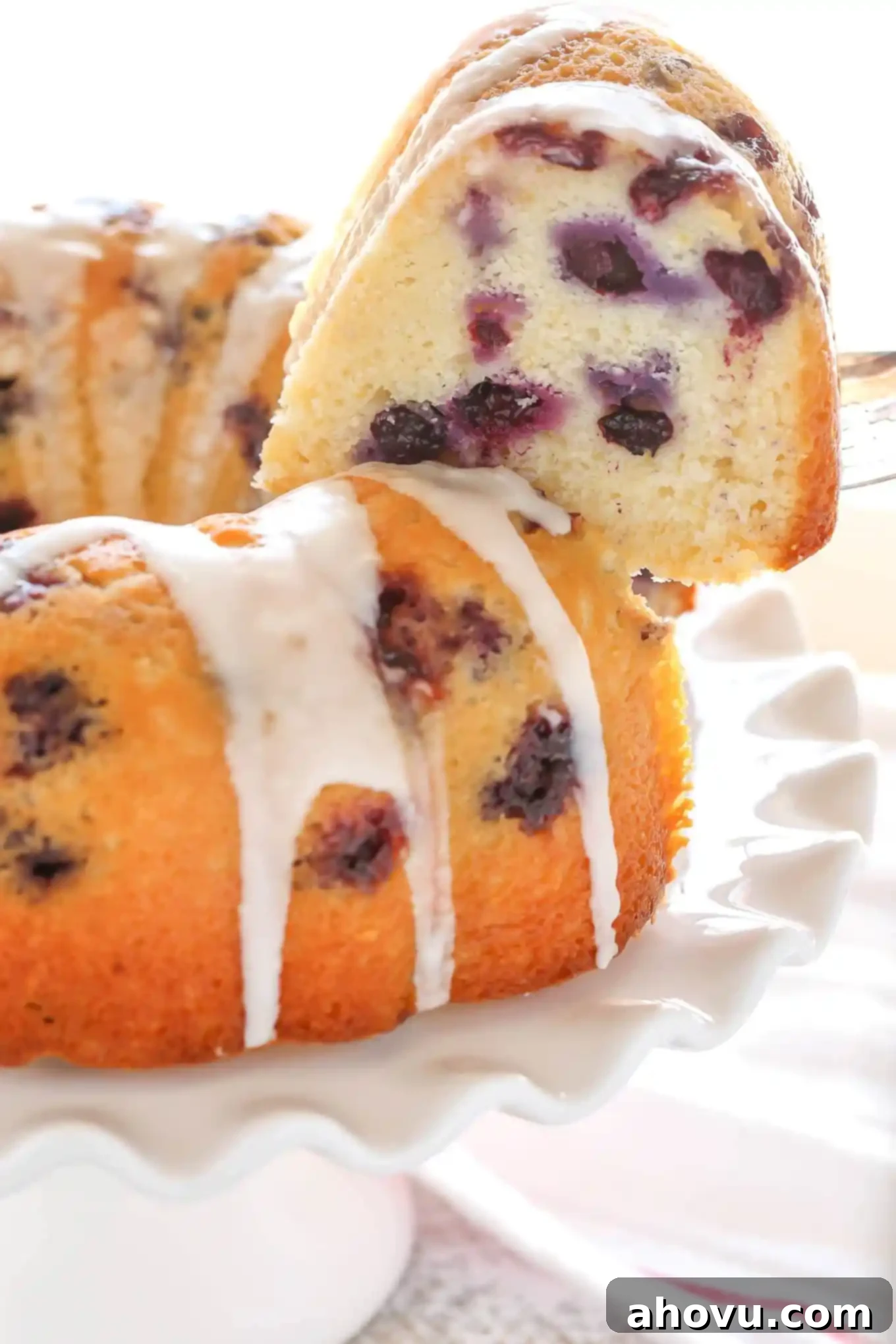 A moist lemon bundt cake filled with fresh blueberries and topped with a sweet lemon glaze. This Lemon Blueberry Bundt Cake is a perfect dessert for lemon lovers!