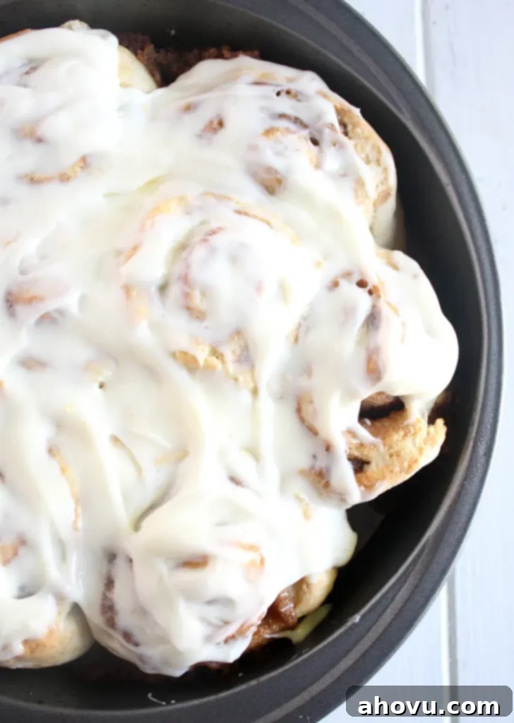 Overhead view of frosted homemade cinnamon rolls without yeast. 