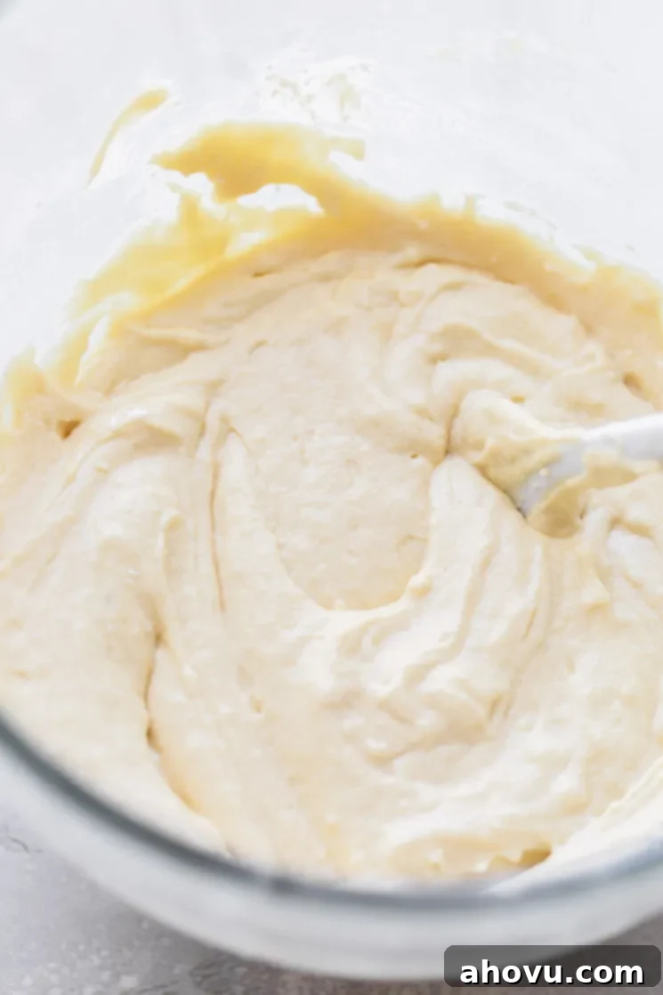 Golden Pineapple Flip Cake 4 A glass mixing bowl holding cake batter that has been mixed up.