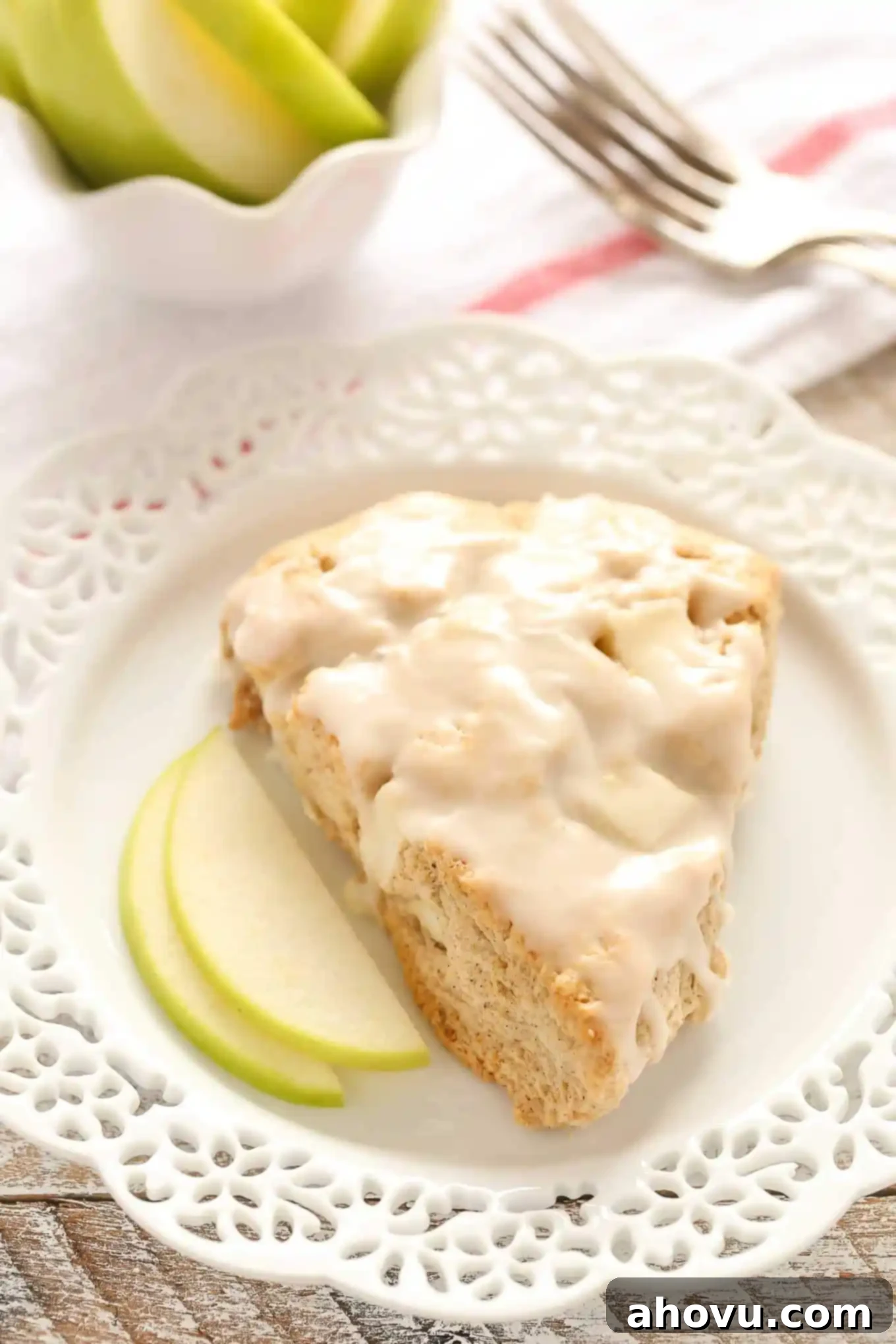 Closeup of freshly baked Apple Cinnamon Scones, featuring golden tops and a sprinkle of spices, ready for a delicious breakfast.