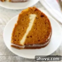 Pumpkin Swirl Cream Cheese Bundt 6 A top-down view of the beautifully glazed Pumpkin Cream Cheese Bundt Cake, ready for serving.