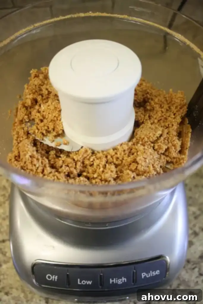 Process shot showing how to make homemade peanut butter. 