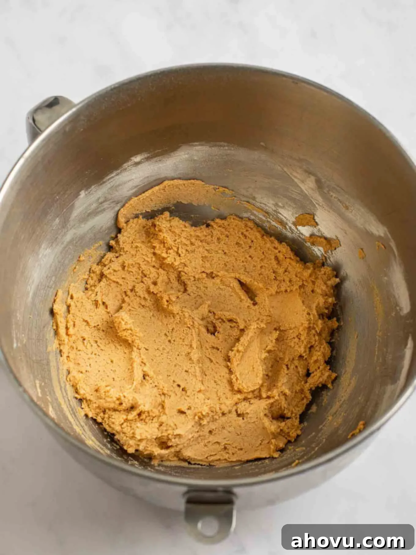 Spiced Pumpkin Snickerdoodles 7 Perfectly mixed pumpkin snickerdoodle cookie dough, showcasing its smooth texture and warm, inviting color, ready for chilling and shaping.