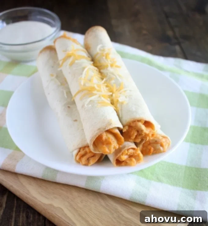 Delicious Baked Buffalo Chicken Taquitos on a Platter