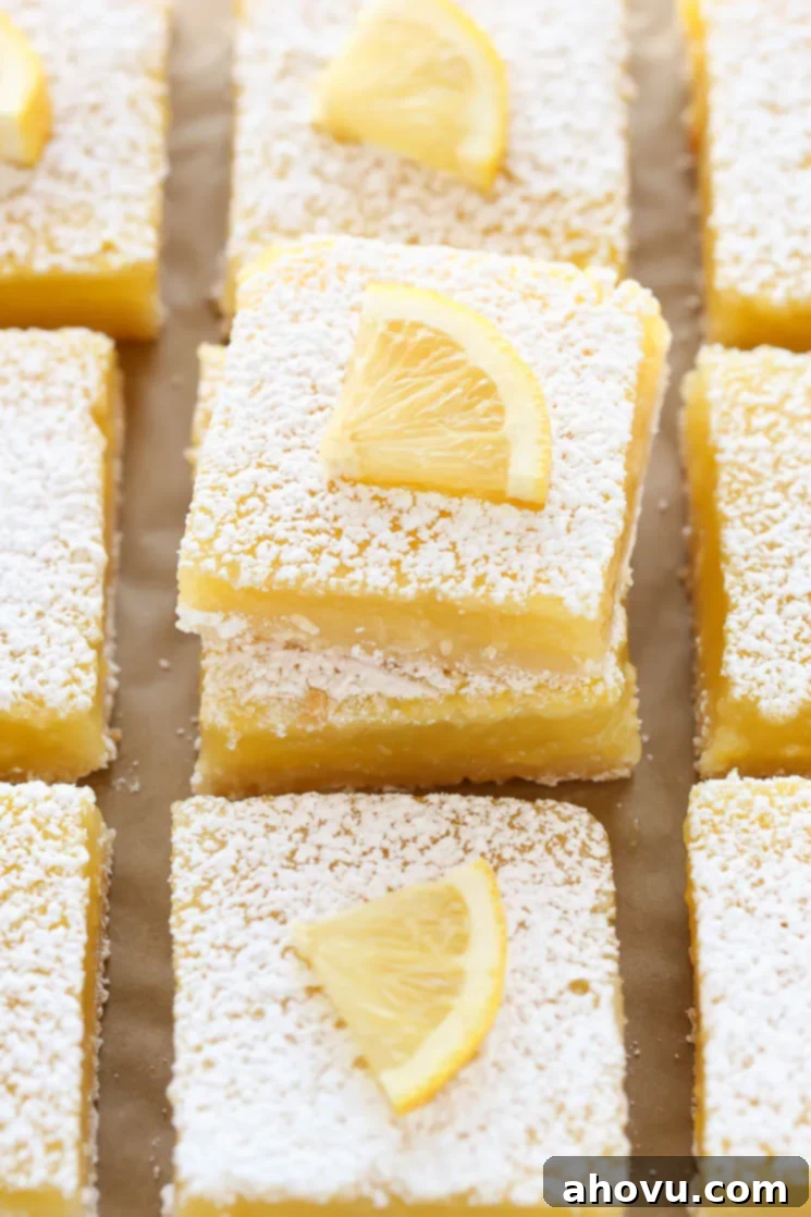 These Classic Lemon Bars feature an easy homemade shortbread crust and a sweet and tangy lemon filling. These bars are so easy to make and perfect for lemon lovers!