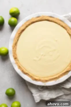 Overhead view of an unbaked key lime pie.