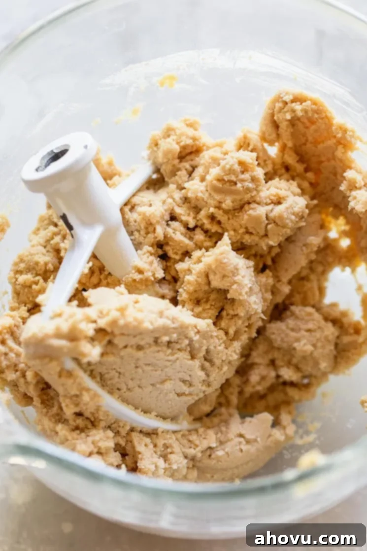 Ultimate Soft and Chewy Snickerdoodles 4 A glass mixing bowl filled with perfectly mixed snickerdoodle cookie dough, ready for chilling.