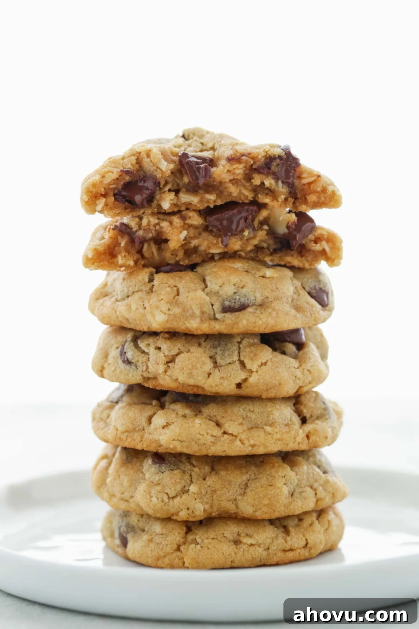 Dreamy Soft Peanut Butter Oatmeal Chocolate Chip Cookies 6 A beautiful stack of Peanut Butter Oatmeal Chocolate Chip Cookies presented on a clean white plate, highlighting their inviting texture and delicious appearance.