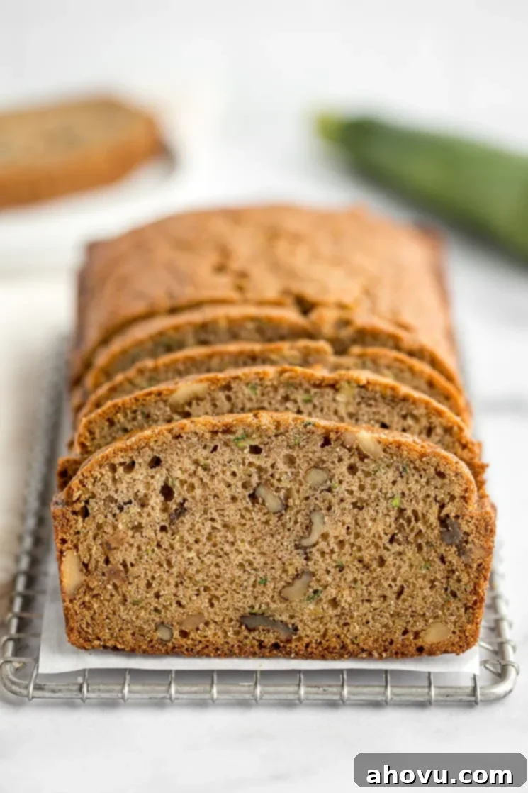 Grandma's Zucchini Bread 2 A sliced zucchini bread sitting on top of an antique safety grater.