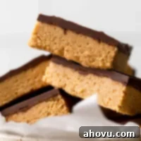 Effortless Peanut Butter Chocolate Treats 6 A pile of peanut butter chocolate bars in a speckled dish.