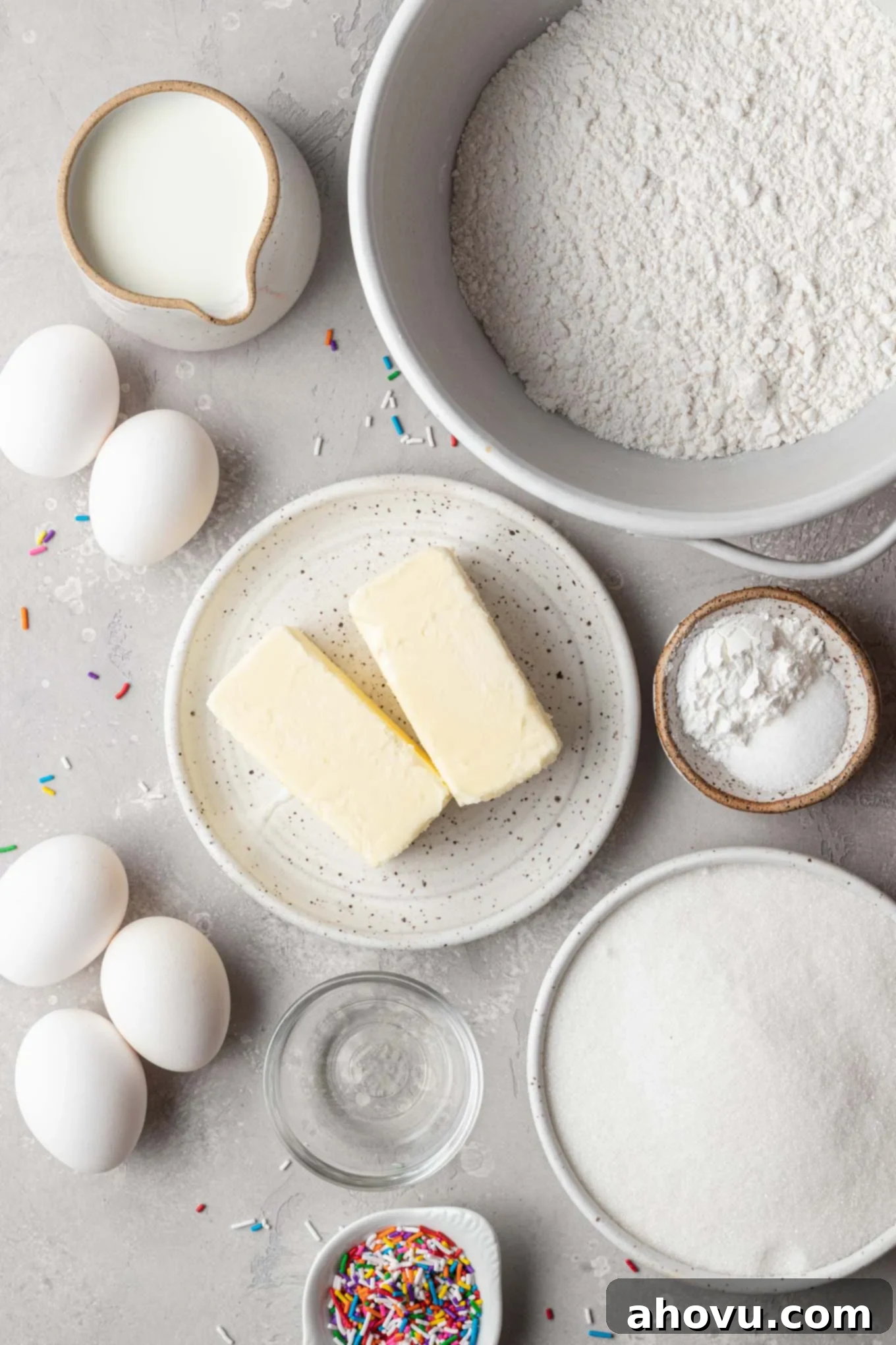 An overhead view of the ingredients needed to make a classic white cake recipe. 