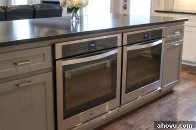 Innovative kitchen design featuring two single ovens built into the island, optimizing space and functionality.