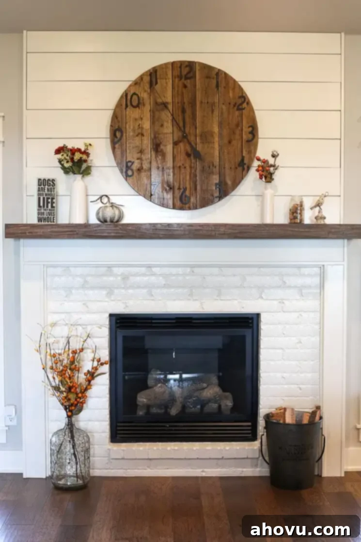 A cozy living room featuring a white painted brick fireplace with shiplap above the mantle, exuding modern farmhouse charm.