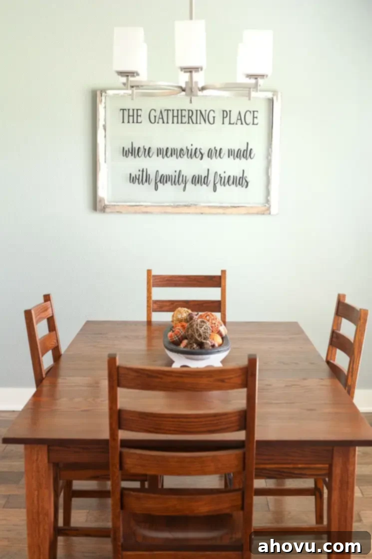 A charming dining room with natural light, featuring a farmhouse table ready for family gatherings.