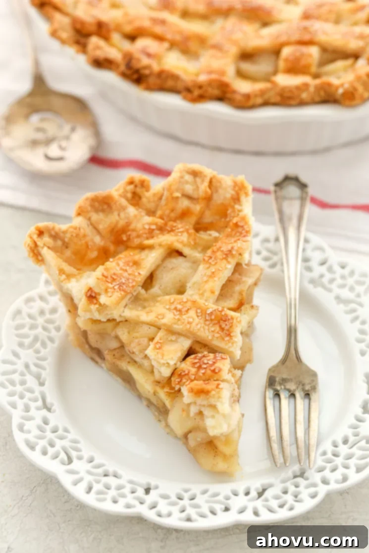 Mastering the Lattice Pie Crust 8 A beautifully baked apple pie featuring a perfectly crafted lattice topping, golden brown and sprinkled with sugar, ready to be sliced.