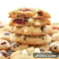 A beautifully presented soft and chewy white chocolate cranberry cookie, perfect for a festive occasion.