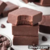 Foolproof Fudge in Minutes 7 Three pieces of fudge stacked on top of each other. The top piece has a bite taken out of it.