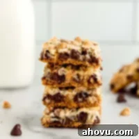 Irresistible Magic Bars 6 A stack of magic cookie bars on a marble surface.