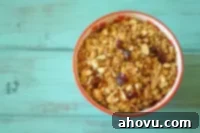 Handcrafted Granola Goodness 4 Close-up of baked granola with almonds and cranberries