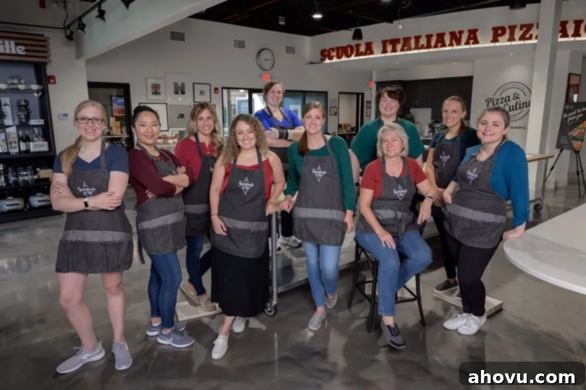 A group of bloggers in aprons.
