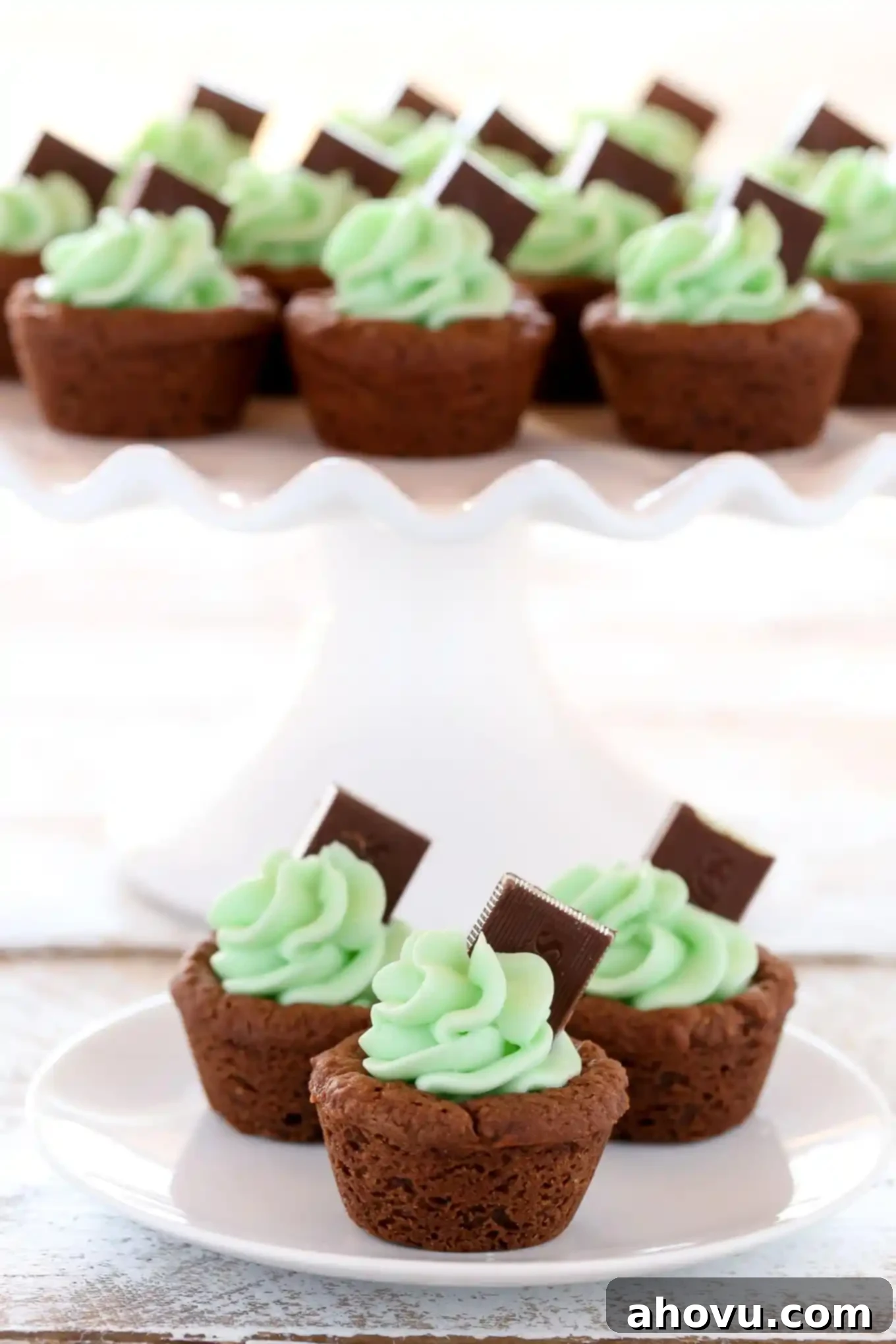 Mint Chocolate Cookie Treats 3 Freshly baked chocolate cookie cups cooling in a mini muffin pan, ready for frosting. Perfect indentations for mint filling.