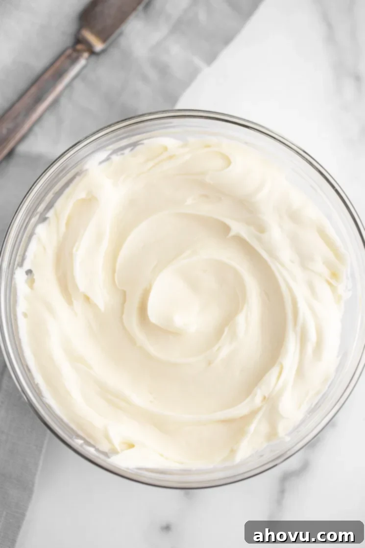 Banana Cake 5 A glass mixing bowl filled with homemade cream cheese frosting. Creamy and smooth homemade cream cheese frosting ready for application.