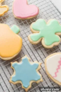 Iced cut out sugar cookies on a wire cooling rack.