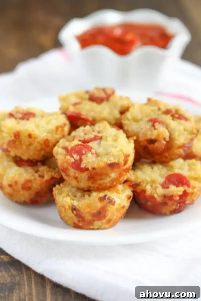A beautifully presented plate holding several mini quinoa pizzas, garnished with fresh herbs, ready to be enjoyed.