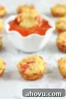 A close-up of mini quinoa pizzas, showcasing the texture of the quinoa crust and the melted cheese with pepperoni.