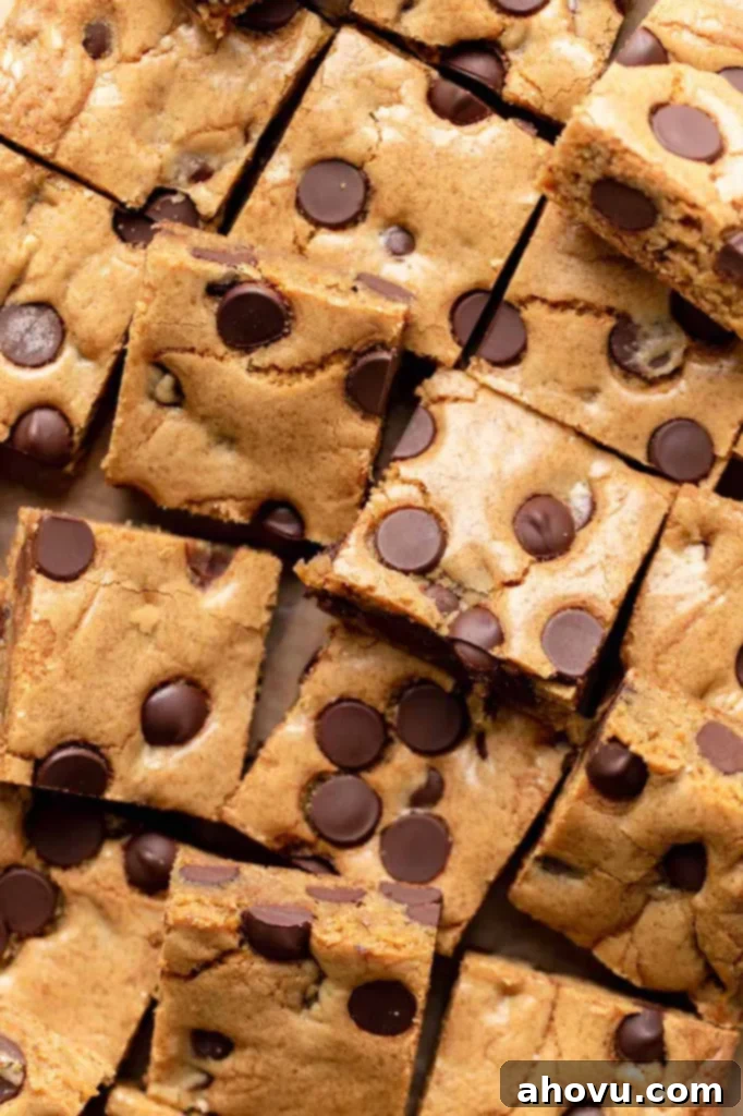 An overhead shot showcasing a perfect arrangement of freshly sliced chocolate chip cookie bars on a clean surface, ready to be enjoyed.