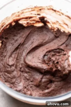 A glass mixing bowl holding the finished batter ready to be scooped out.