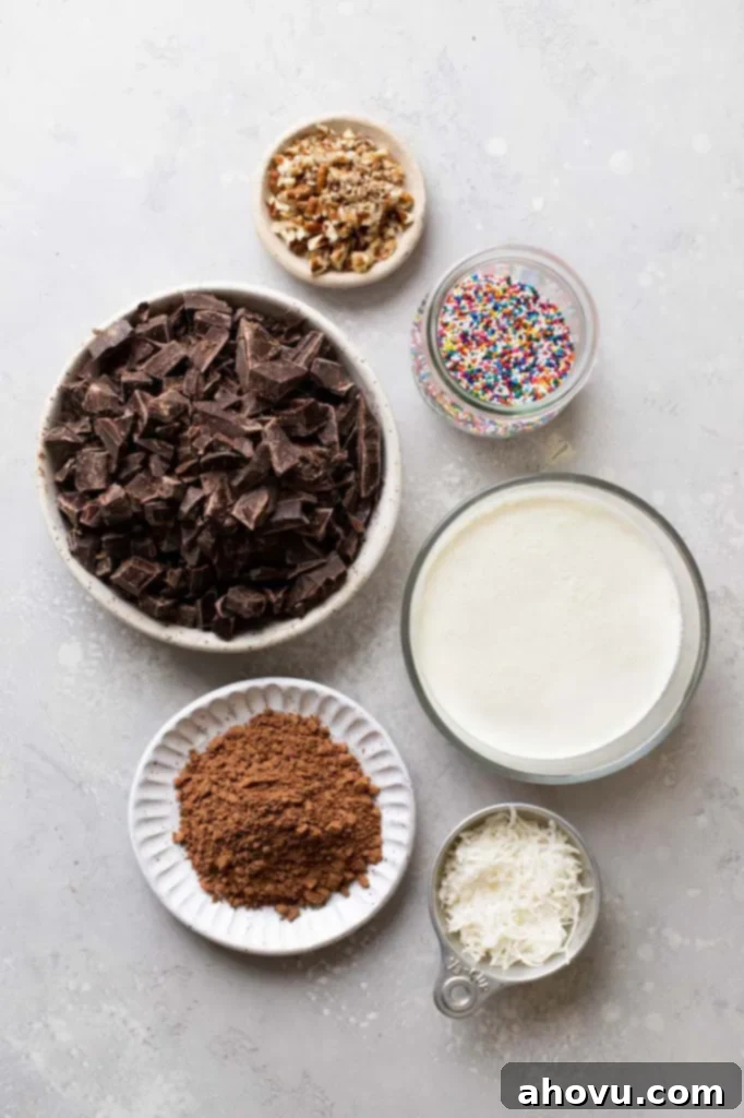 Overhead view showcasing the two main ingredients needed to prepare the best homemade chocolate truffles: chocolate bars and a carton of heavy cream.