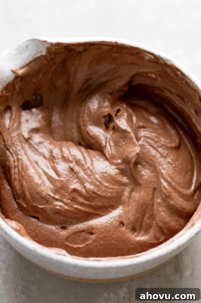 Chocolate cake batter in a mixing bowl. 