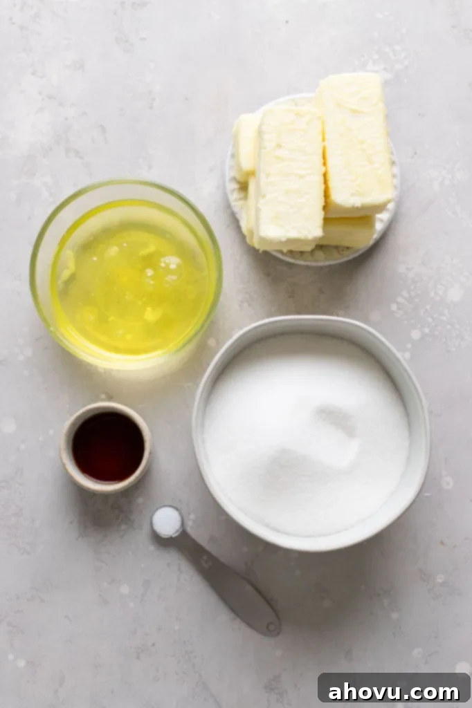 An overhead view of the ingredients needed to make Swiss buttercream frosting. 