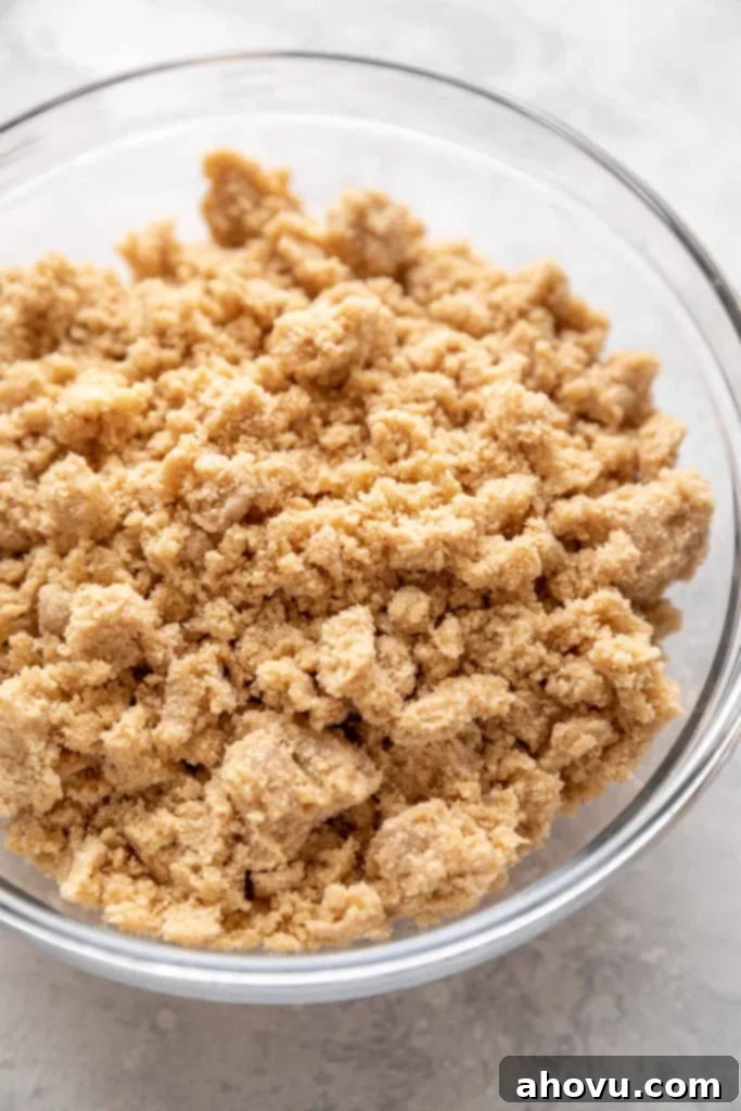 A bowl filled with crumb topping.