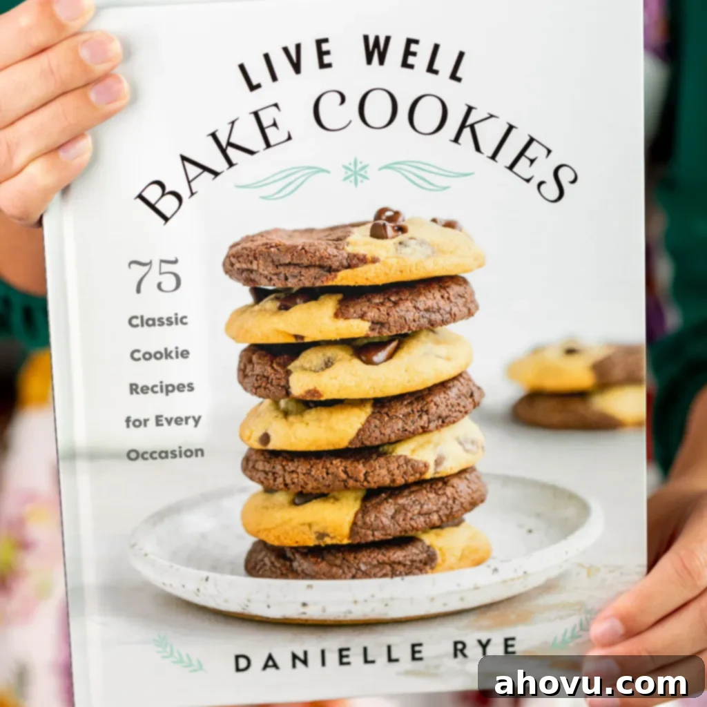 An image of the cookbook Live Well Bake Cookies being held in front of a camera, showcasing its beautiful cover.