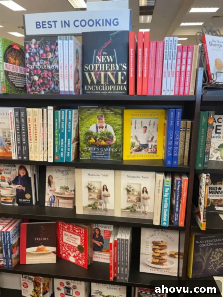 Several copies of the 'Live Well Bake Cookies' cookbook proudly displayed on a shelf in a bustling bookstore.