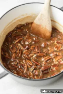 A pot filled with runny praline mixture.