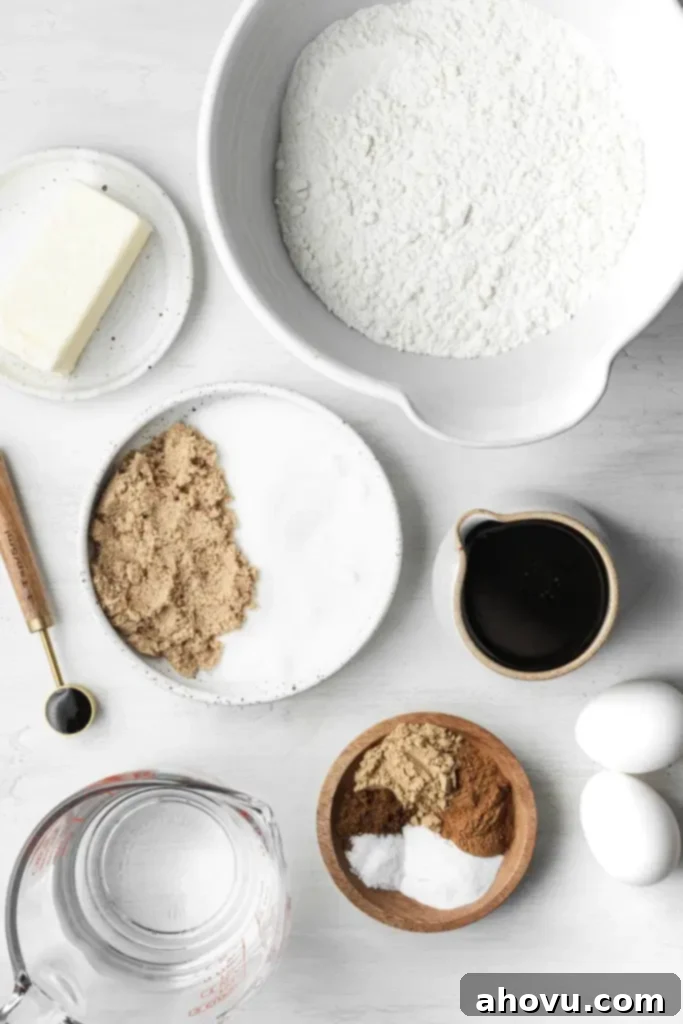 Overhead view of the ingredients needed to make a spiced molasses cake. 