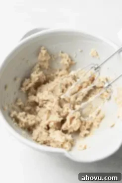 Creamed butter and sugar in a mixing bowl with electric beaters.