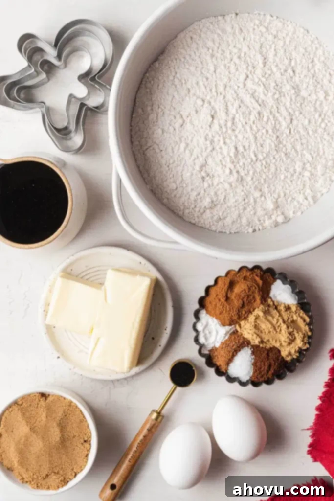 An inviting overhead shot showcasing all the essential ingredients for baking perfect homemade gingerbread cutout cookies, neatly arranged on a kitchen surface.
