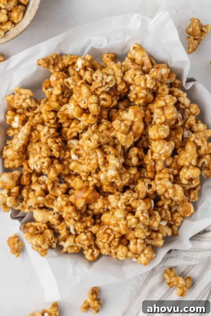 An overhead view of baked caramel corn in a metal tart pan. 