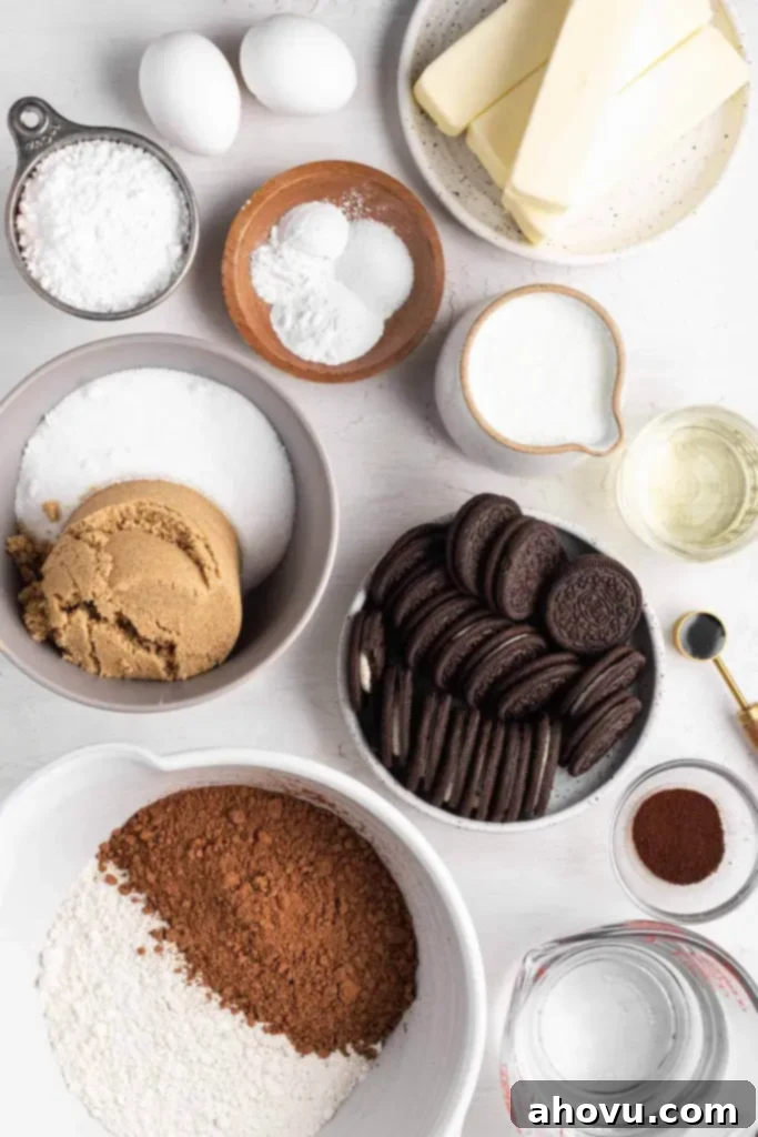 Decadent Oreo Cake 3 An inviting overhead view showcasing all the carefully measured ingredients required to bake a delicious homemade Oreo cake, neatly arranged on a kitchen counter, ready for preparation.