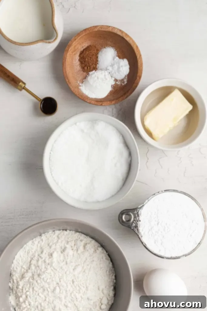 An overhead view showcasing all the simple ingredients meticulously laid out for this easy baked donut recipe, ready for preparation.