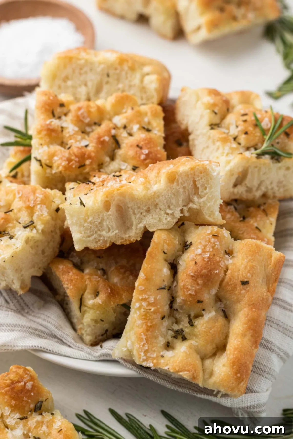 Focaccia slices piled high on a plate. 