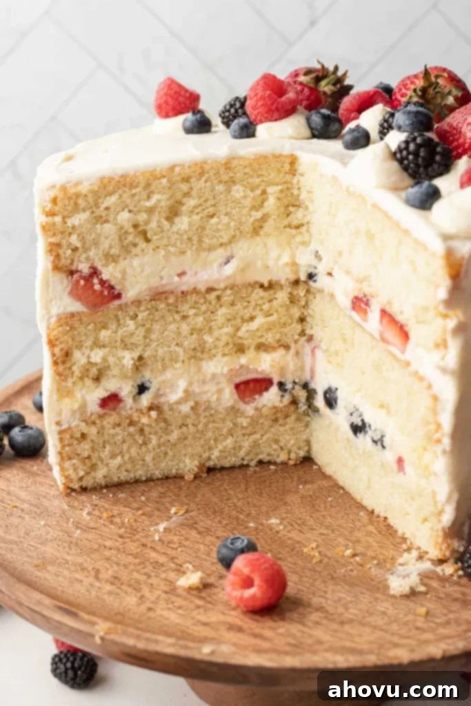 A side view of a sliced Chantilly cake, with the layers showing. 