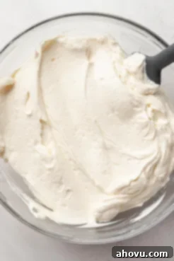 An overhead view of chantilly cake frosting in a bowl.