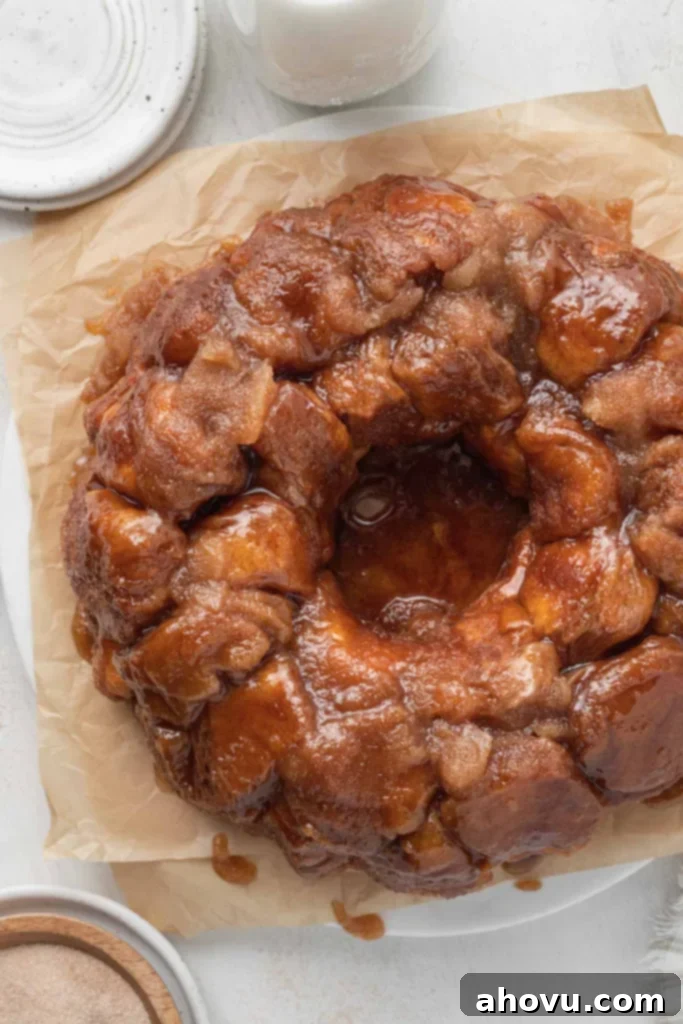 An overhead view of pull apart monkey bread on parchment paper. 